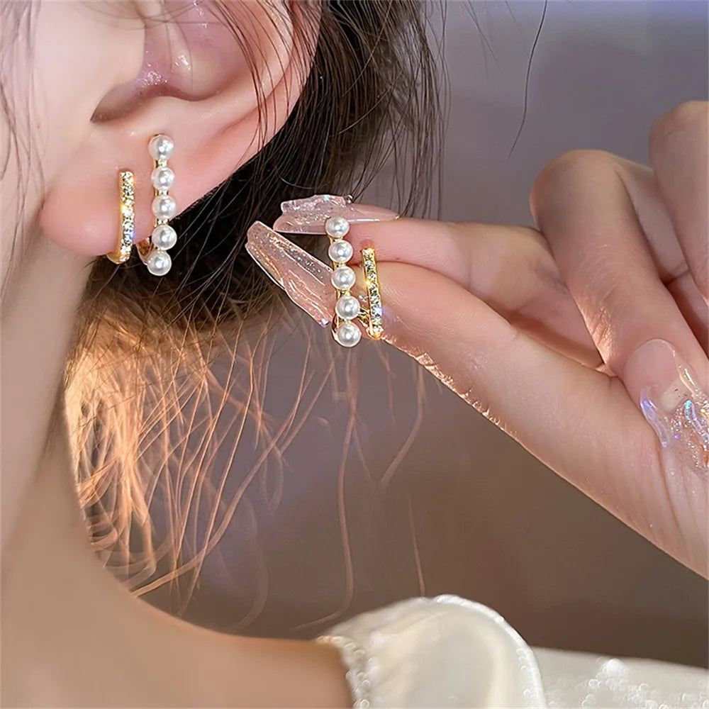 Handmade pearl earrings with sparkling crystals and micro pave.