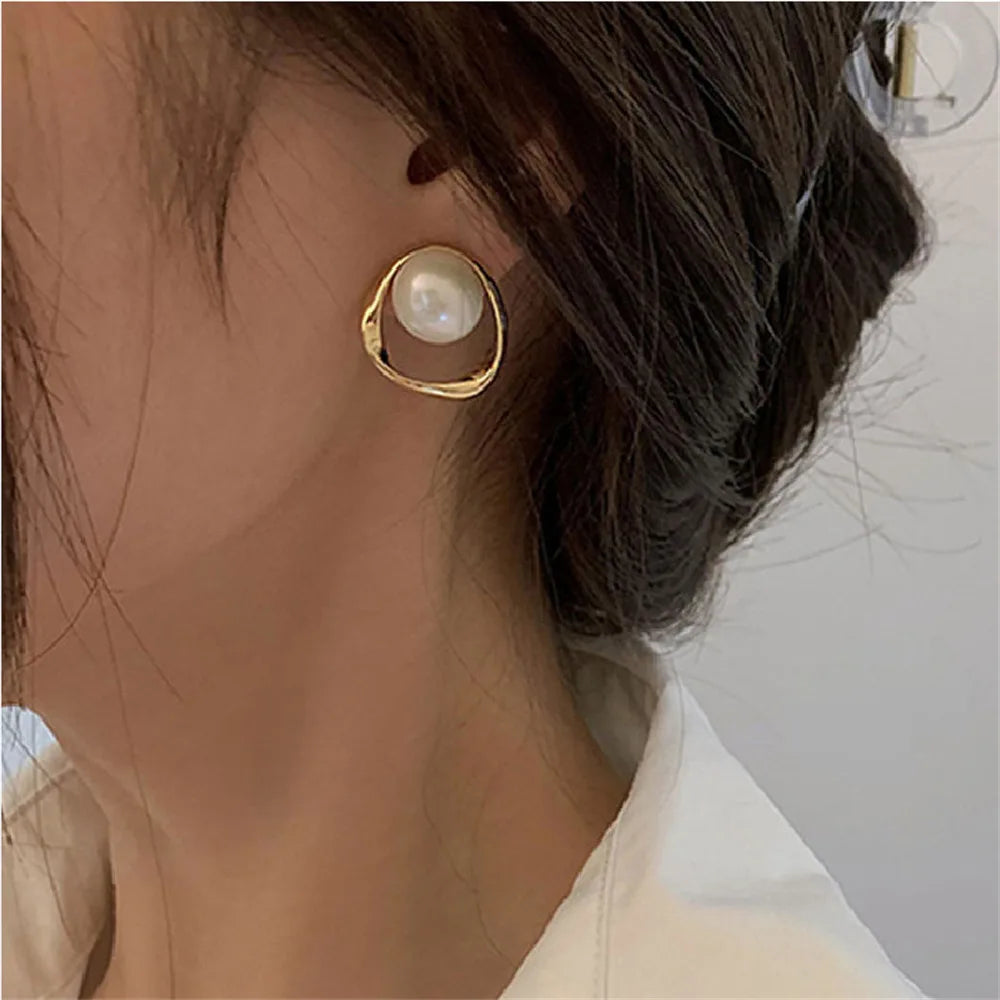 Handmade pearl earrings with sparkling crystals and micro pave.