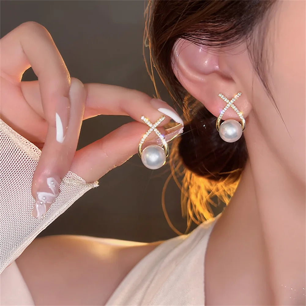 Handmade pearl earrings with sparkling crystals and micro pave.