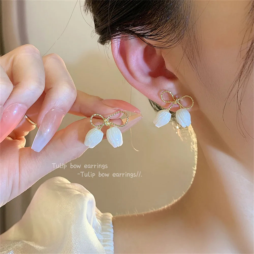 Handmade pearl earrings with sparkling crystals and micro pave.